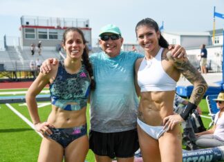 a group of women standing next to each other on a field