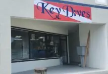 a sign that says key drives on the side of a building