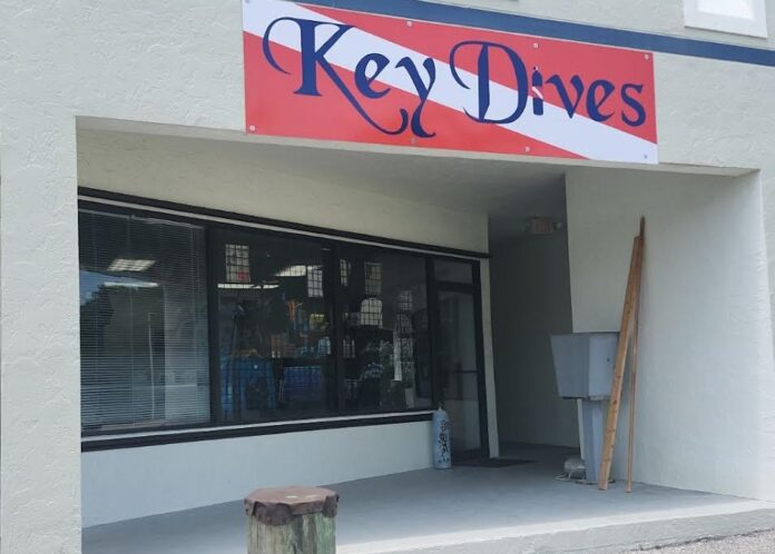 a sign that says key drives on the side of a building