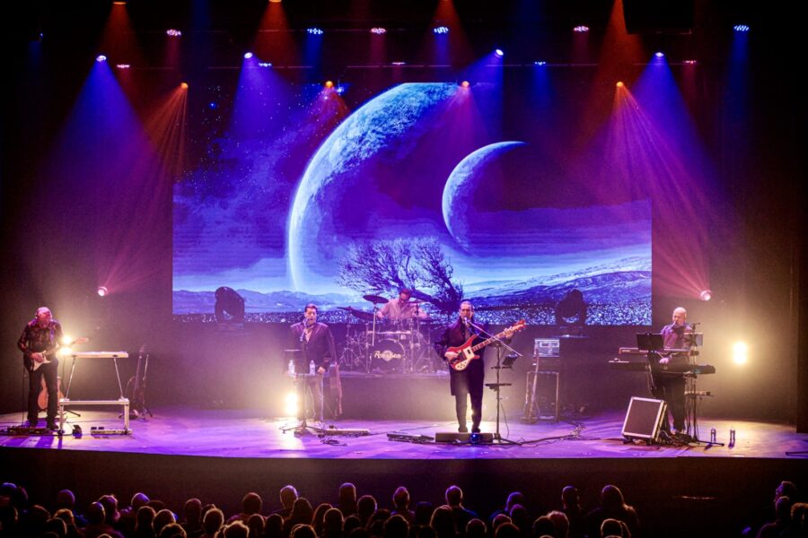 a group of people standing on top of a stage