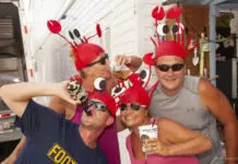 a group of people wearing red hats and sunglasses