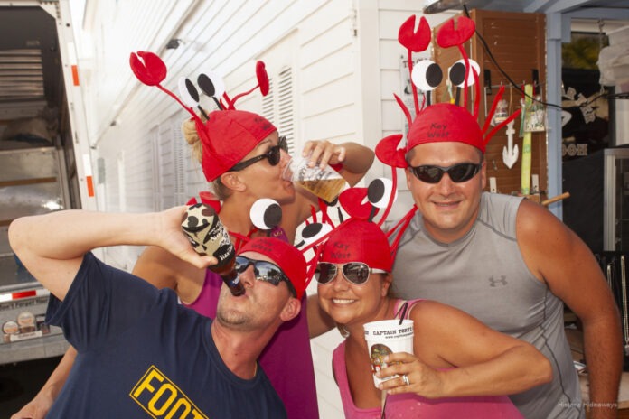 a group of people wearing red hats and sunglasses