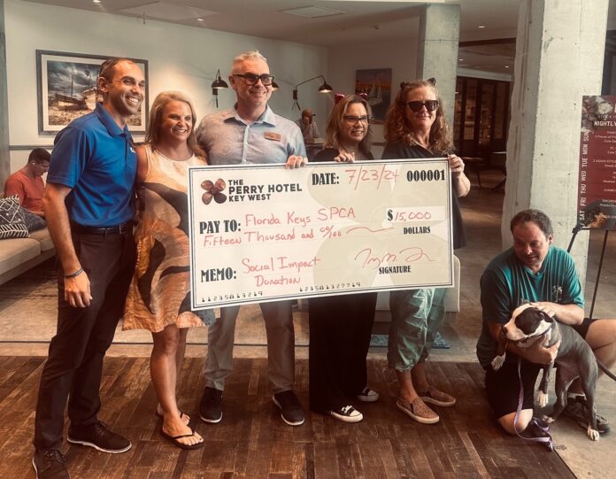 a group of people standing around a large check