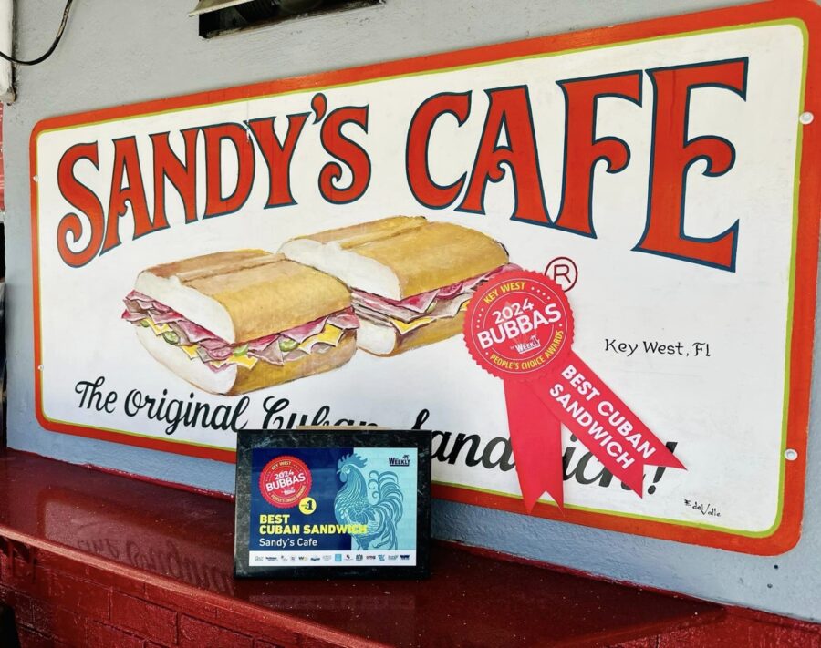 a sandwich sign on the wall of a restaurant