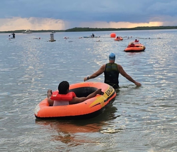 a group of people in a body of water