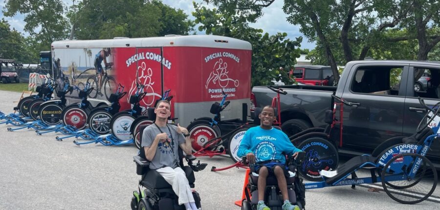 a group of people riding bikes next to a truck