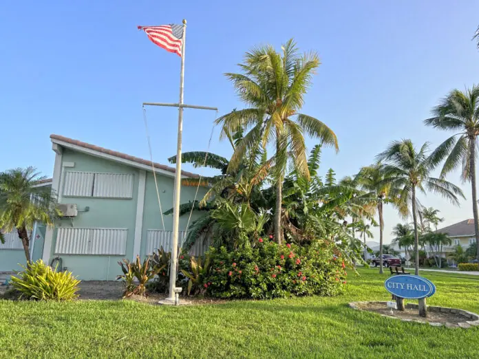 a blue building with a flag on it