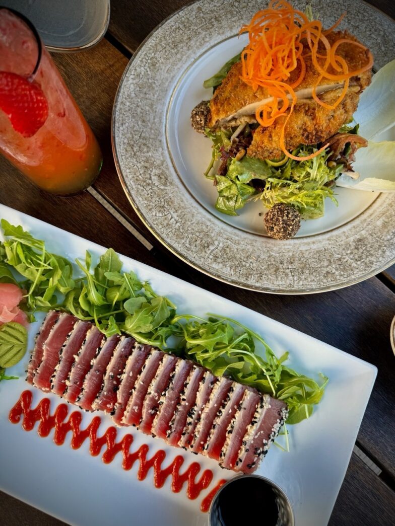 a plate of food on a wooden table