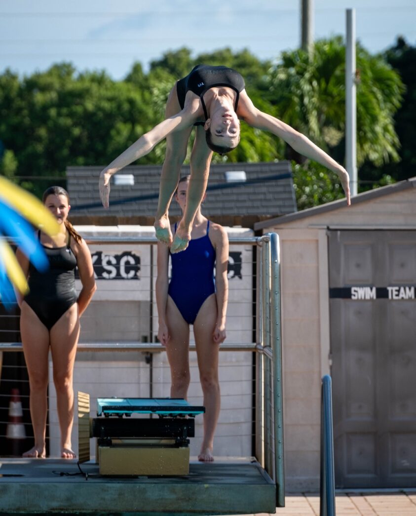 a person on a diving board doing a trick