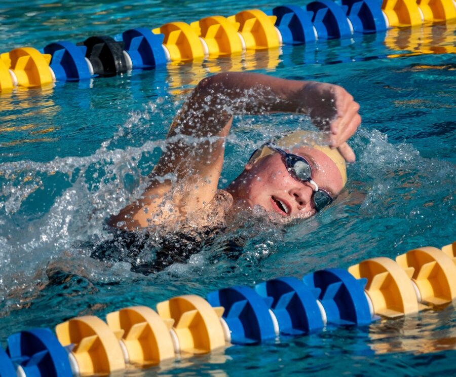 a man swimming in a swimming pool