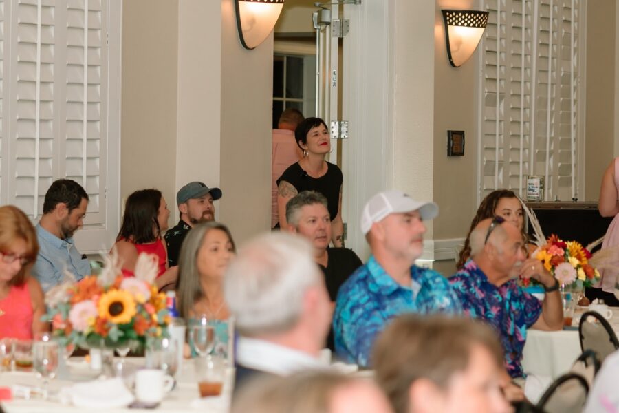 a group of people sitting at tables in a room