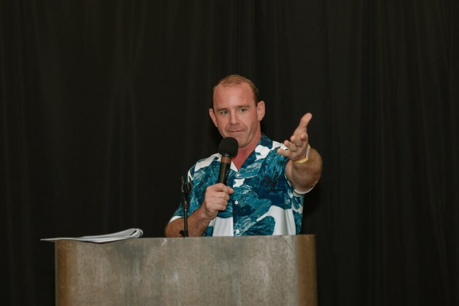 a man giving a speech at a podium