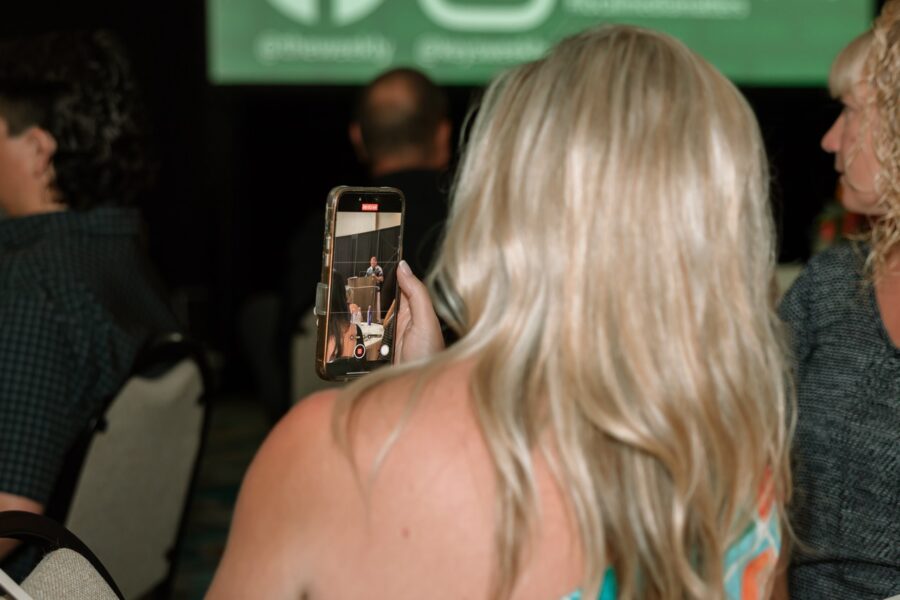 a woman taking a picture with her cell phone