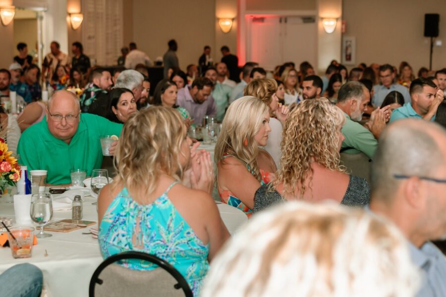 a large group of people sitting at tables