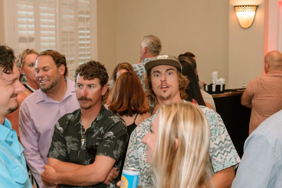 a group of people standing in a room