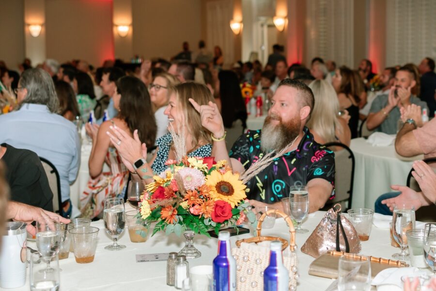 a large group of people sitting at a table