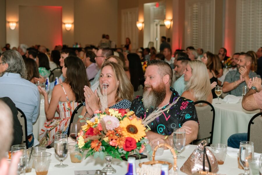 a large group of people sitting at tables