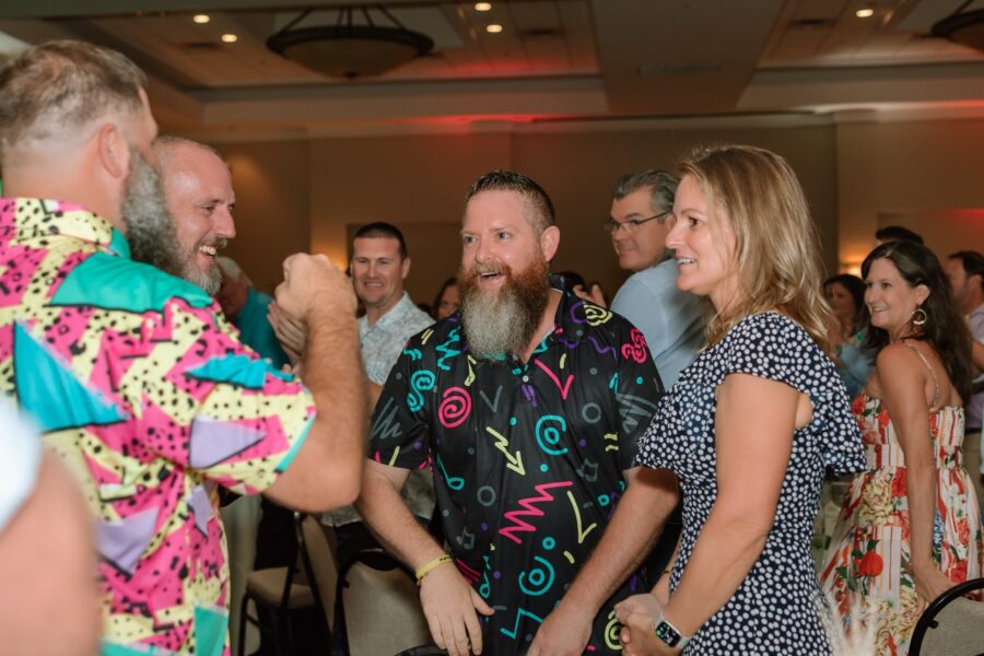 a group of people standing around each other