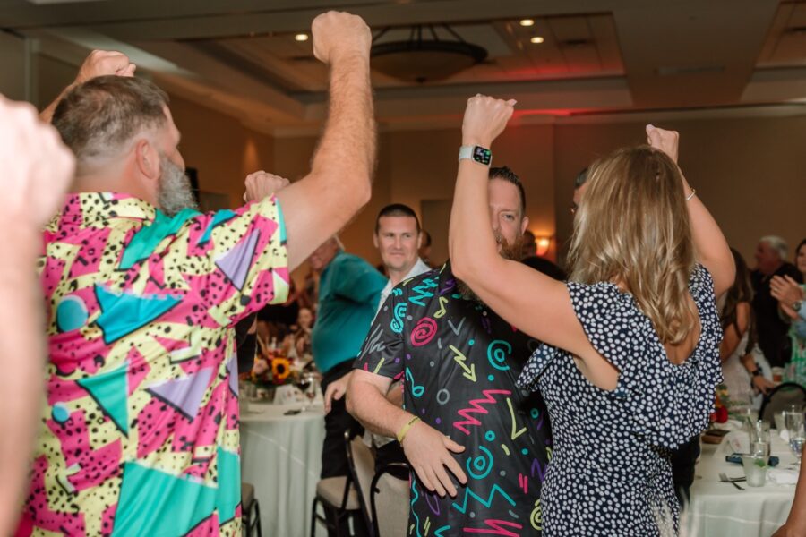 a group of people dancing at a party