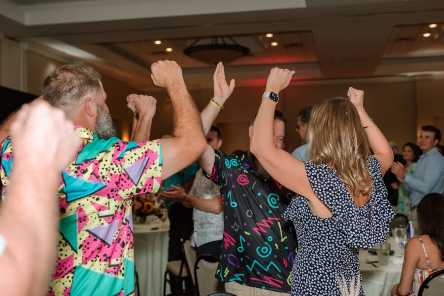 a group of people dancing at a party