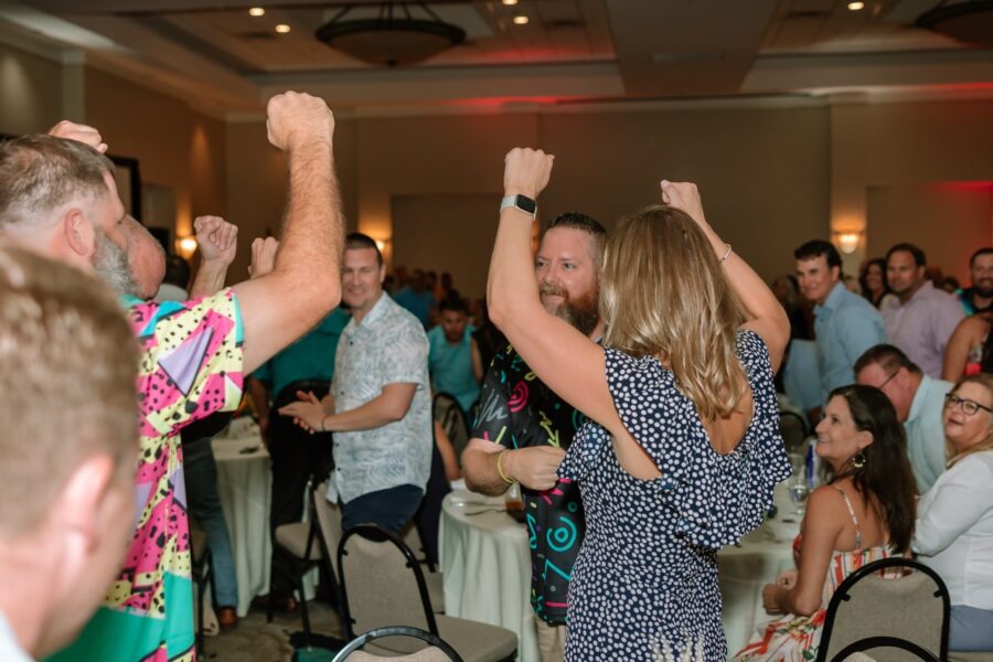 a group of people dancing at a party