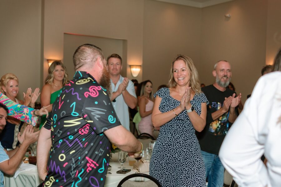 a group of people standing around a room