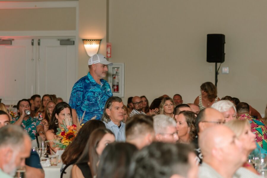 a man standing in front of a crowd of people