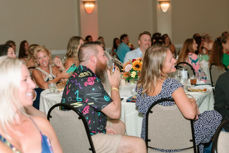 a group of people sitting at tables in a room