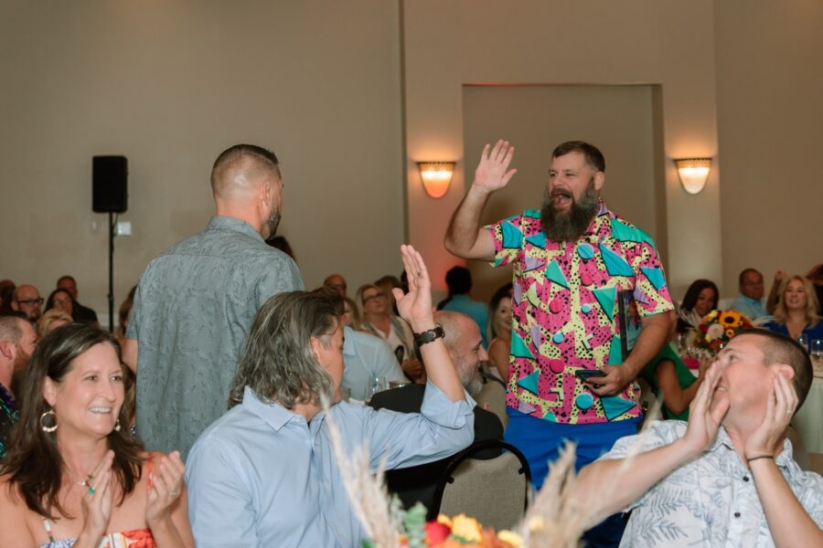 a group of people standing around a room