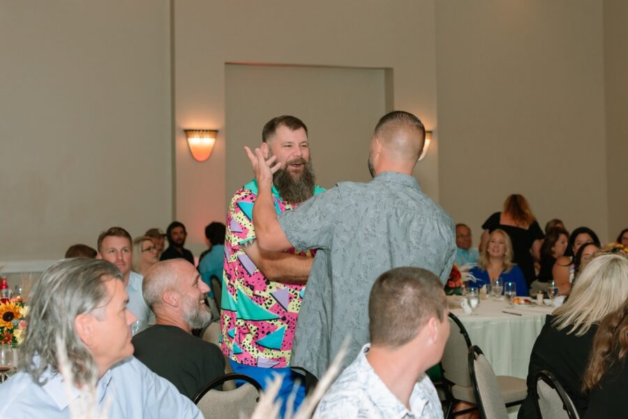 a group of people standing around a room