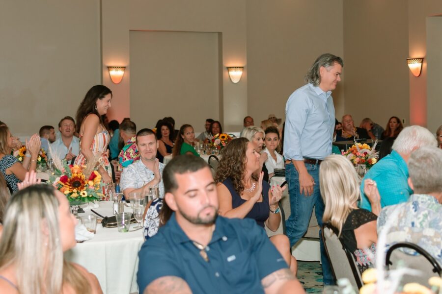 a group of people sitting at tables in a room