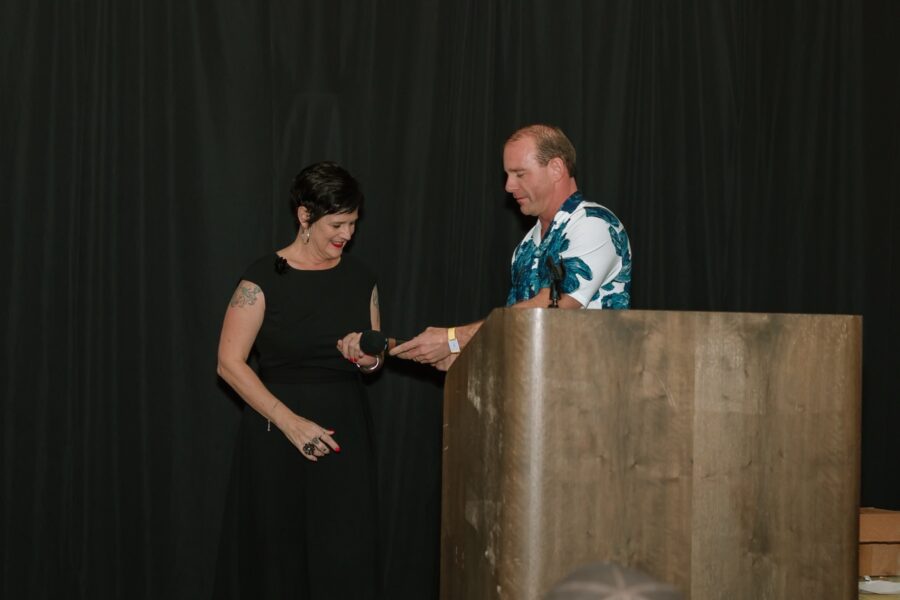 a man and a woman standing at a podium