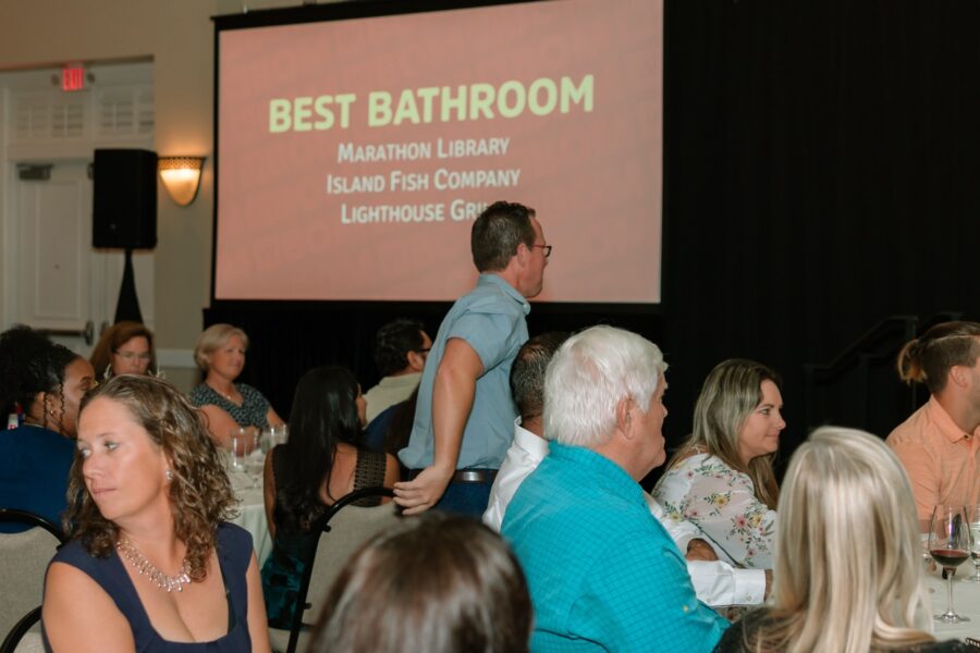 a group of people sitting at tables in a room