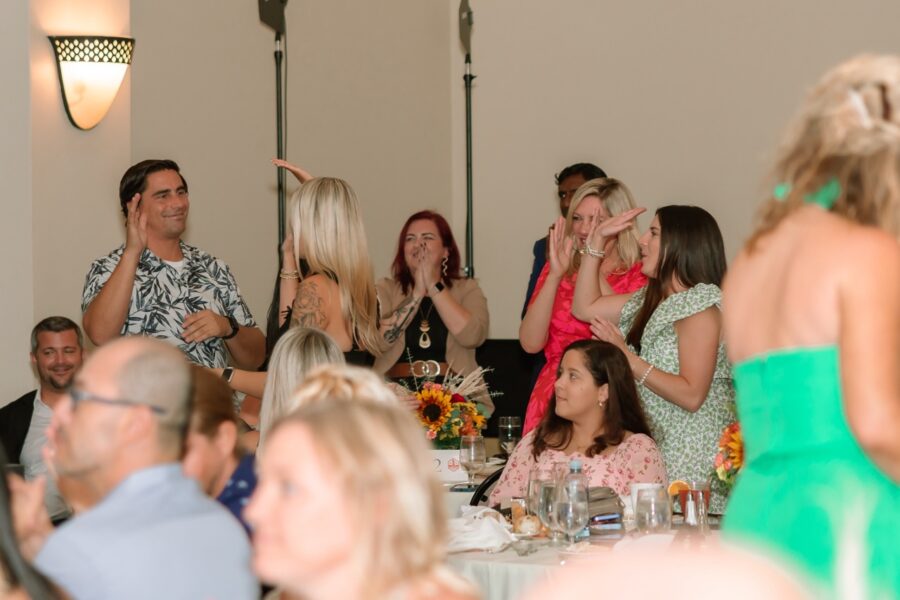 a group of people sitting around a table