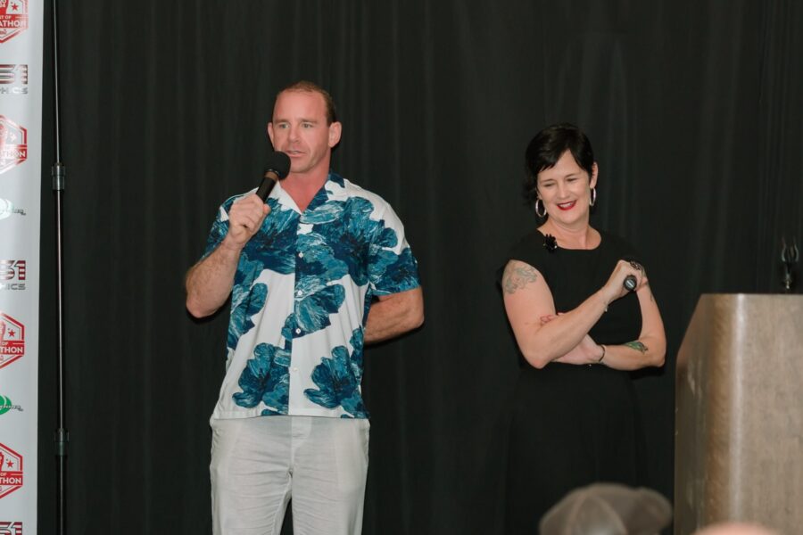 a man and a woman standing on a stage