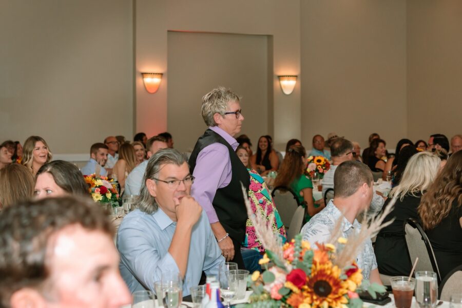 a group of people sitting at tables in a room