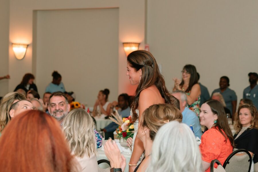 a group of people sitting at tables in a room