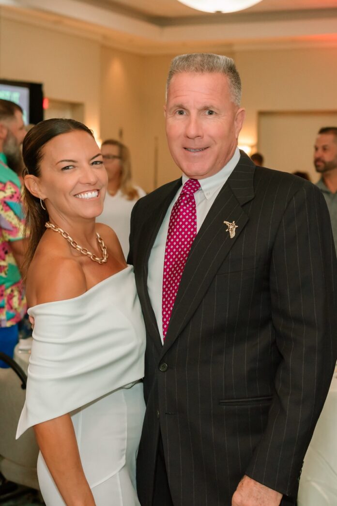 a man and a woman standing next to each other