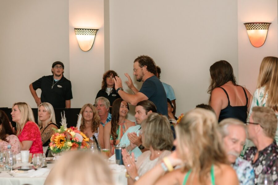 a group of people sitting around a table