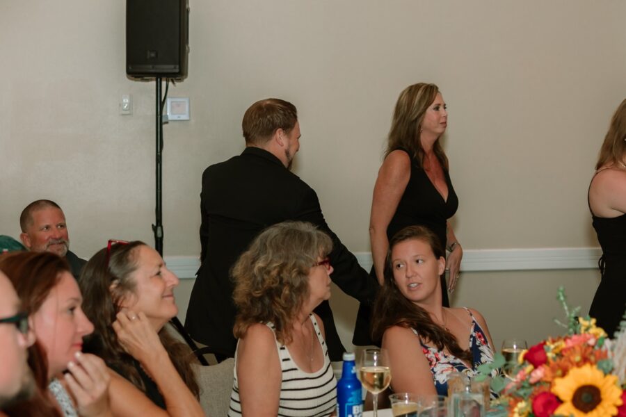 a group of people sitting around a table