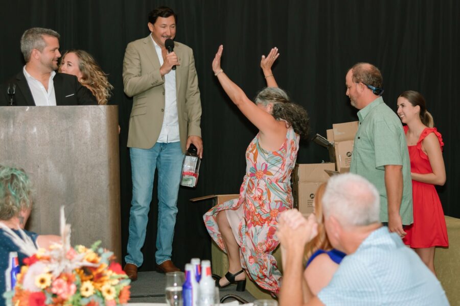 a man giving a speech to a group of people