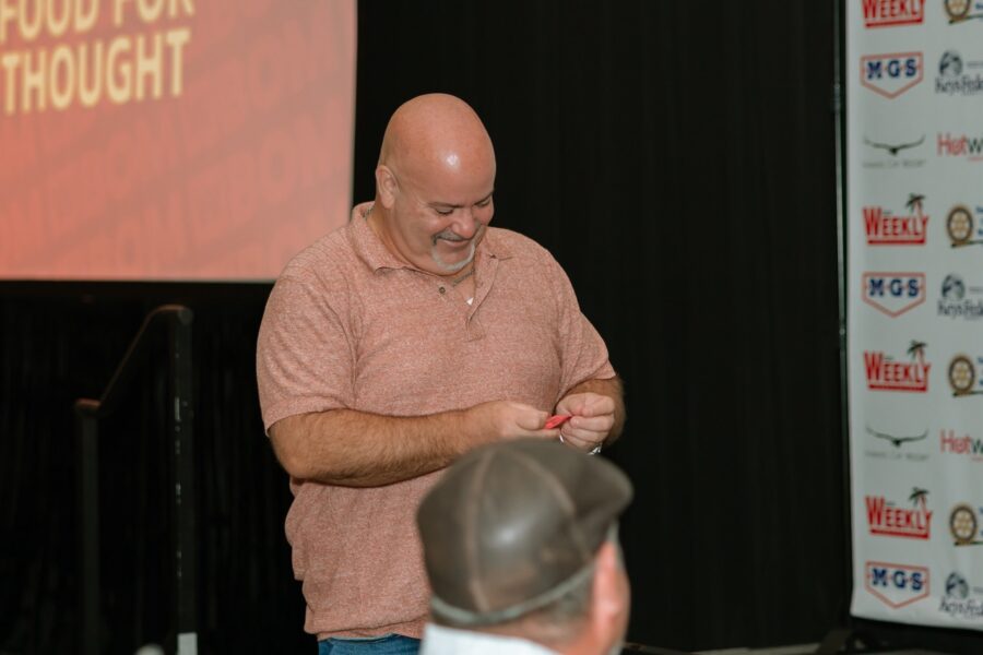 a man standing in front of a crowd of people