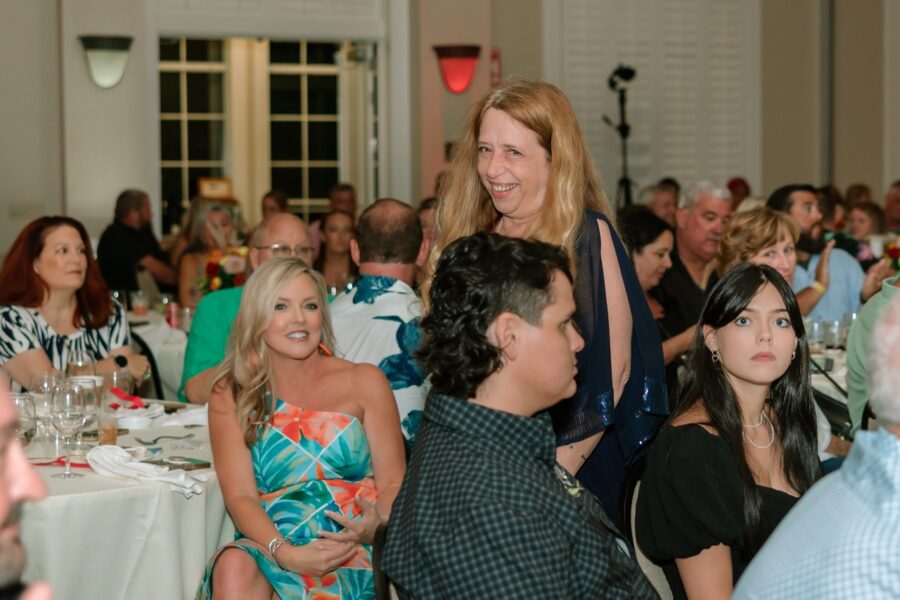 a group of people sitting at tables in a room