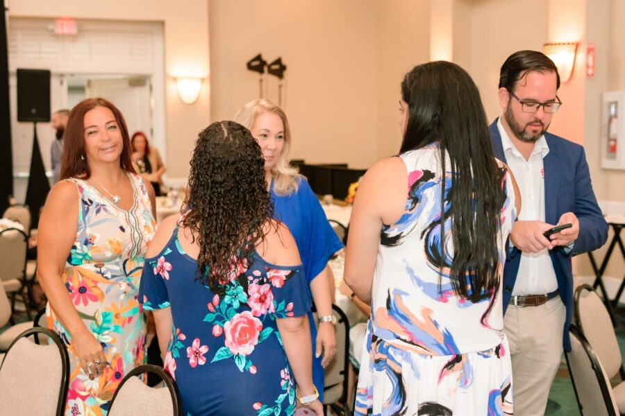 a group of people standing around each other