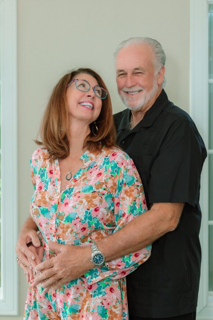 a man and a woman standing next to each other