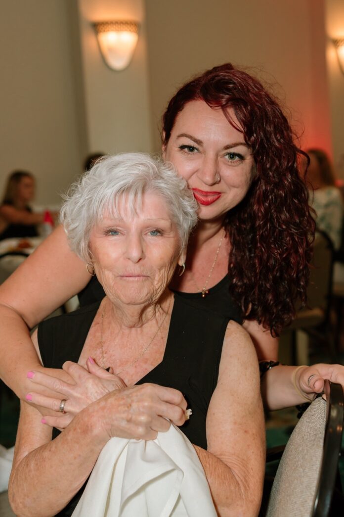 two women hugging each other in a restaurant