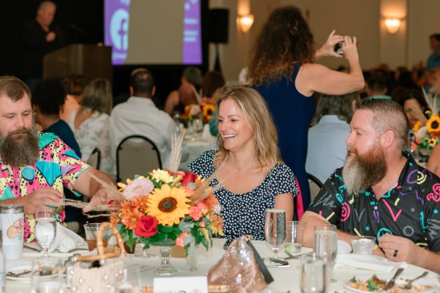 a group of people sitting around a table