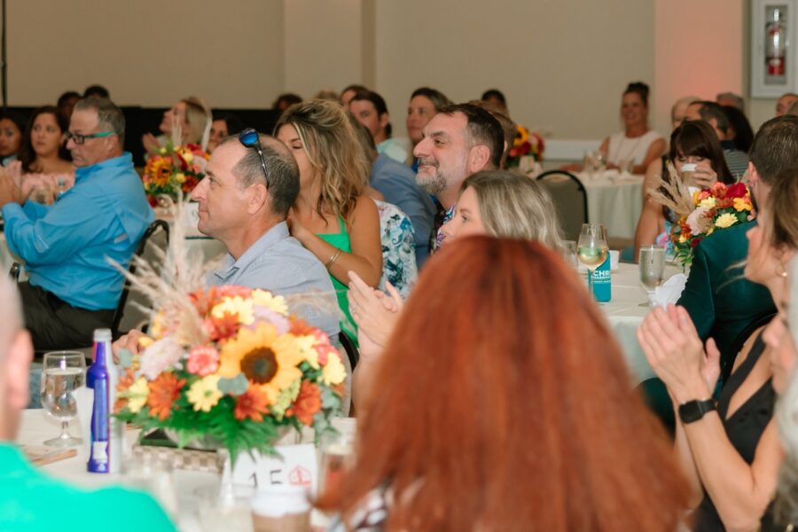 a group of people sitting at tables in a room