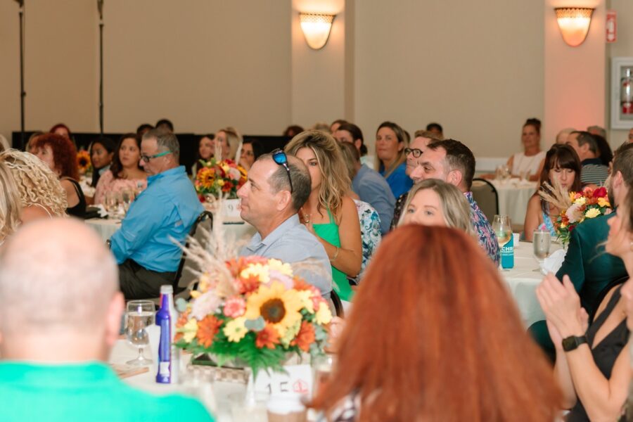 a group of people sitting at tables in a room