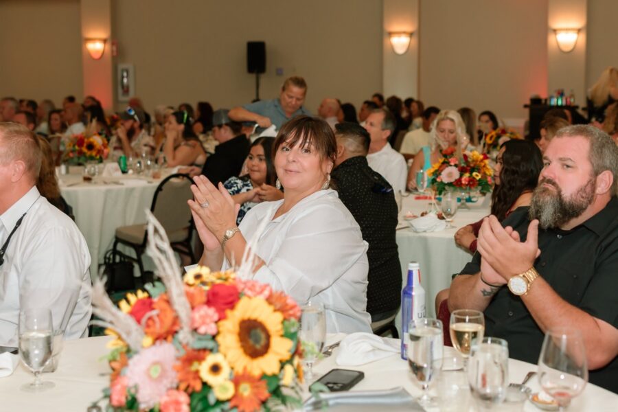 a group of people sitting at a table in a room